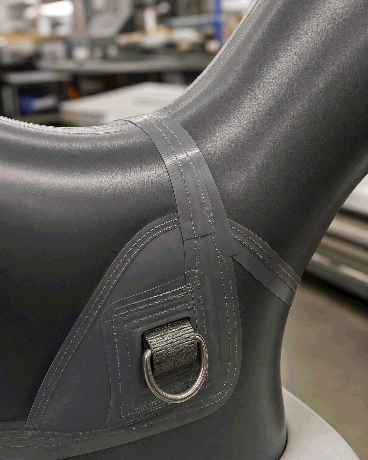 Close-up of curved seams and reinforced joint construction on a custom shaped inflatable