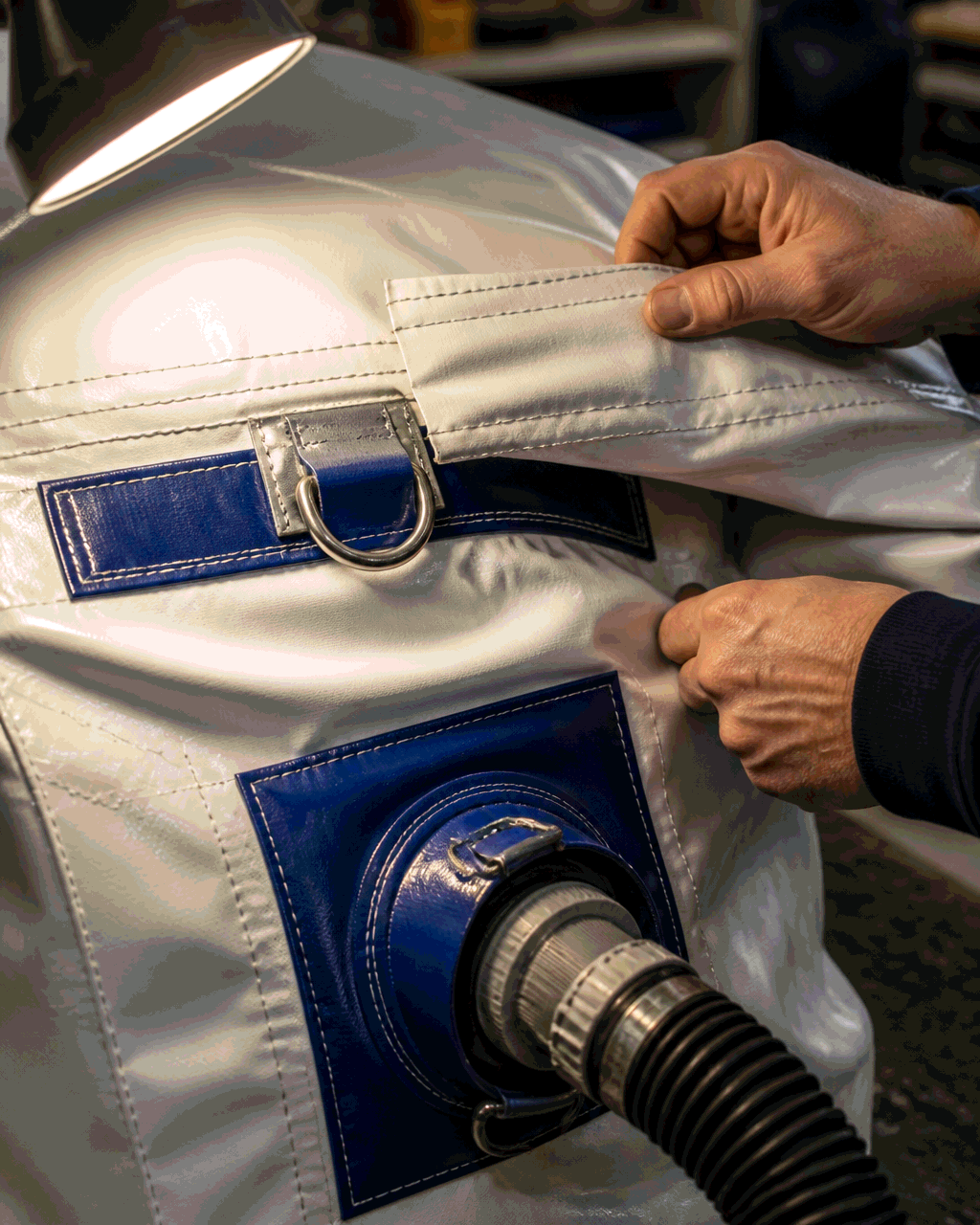 Close-up detail of PVC seam and D-ring on a custom inflatable arch