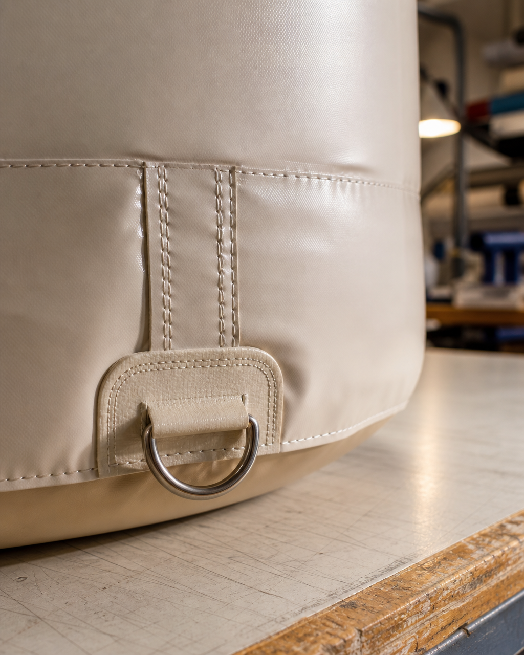 Close-up detail of printed surface, seam construction, and attachment point on a product replica inflatable